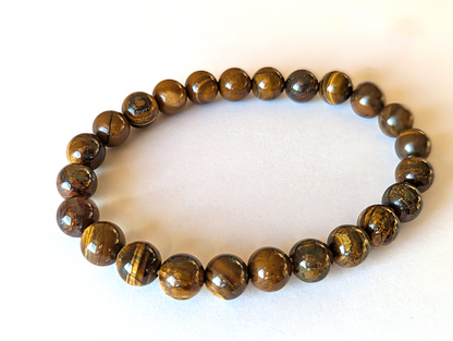 Bracelet œil de Fer en pierres naturelles de 8mm de qualité AA, vue de profil. En lithothérapie , apporte protection et volonté