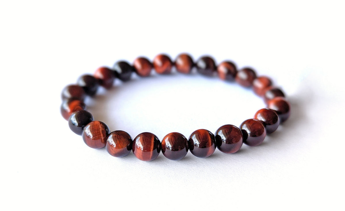 Bracelet Œil de Taureau en pierres naturelles de 8mm de qualité AA. En lithothérapie, apporte protection et dynamisme